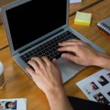 man-typing-on-laptop-at-desk