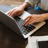 close-up-of-a-businesswoman-typing-on-laptop-compu