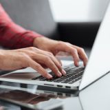 close-up-of-man-typing-on-keyboard